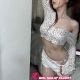 Attractive Malaysia escort girl in white top and shorts.