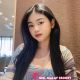 Attractive Malay woman in a stylish top. Melayu Escort Service.