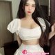 Attractive Kuala Lumpur escort girl in a white outfit.