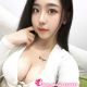 Attractive young Chinese woman in a white top.
