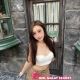 Attractive Malaysian female escort posing outdoors.