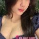 Attractive woman in a blue striped top. KL escort outcall.