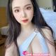 Attractive KL call girl in a white swimsuit.