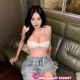 Attractive Malaysian woman in denim shorts and white top. KL Girl Service.