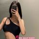 Attractive woman in black one-shoulder swimsuit. Kuala Lumpur escort.