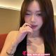 Attractive woman in black top, posing. Hotel escort booking service.
