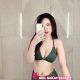 Attractive KL call girl in a green bikini, posing for a selfie.