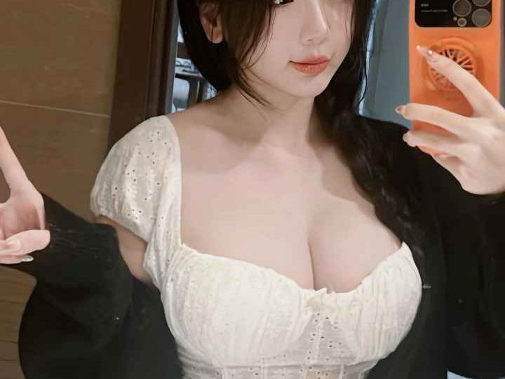 Attractive Malay woman in white dress. Girl Malay Escort.