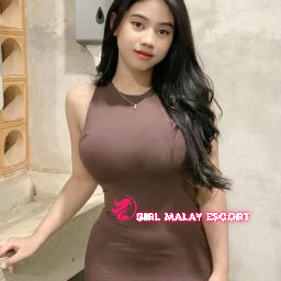 Attractive Malay woman in brown dress. Girl Malay Escort.