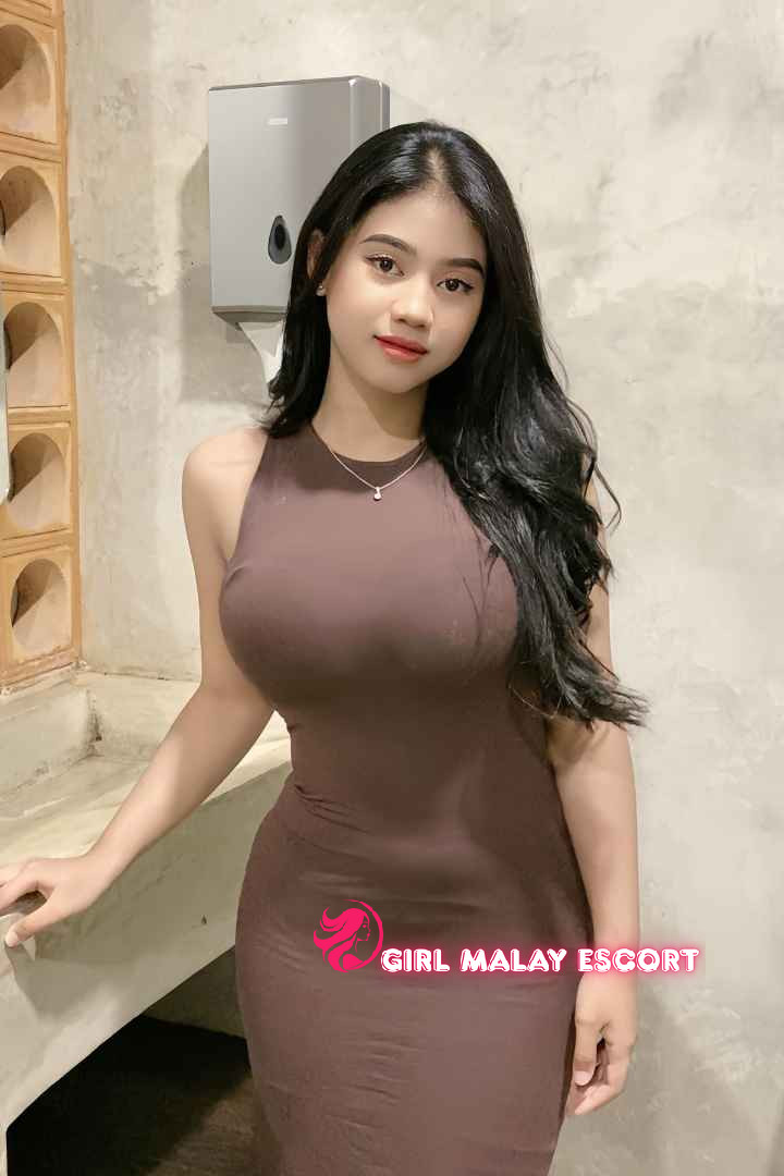 Attractive Malay woman in brown dress. Girl Malay Escort.