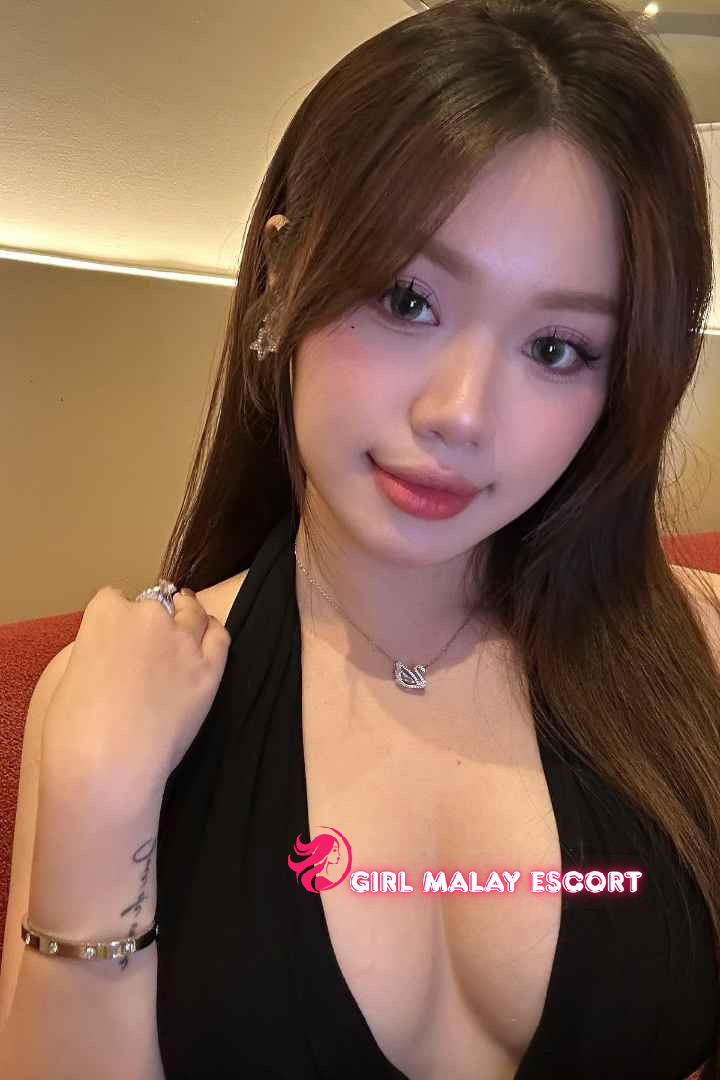 Attractive Malay woman in black top. Girl Malay Escort.