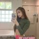 Attractive Malaysian female escort posing in a bathroom.
