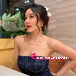 Attractive young Malay woman in a denim dress.