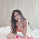 Attractive KL call girl posing on a bed. Escort service.