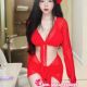 Attractive Kuala Lumpur escort girl in a red dress. Trusted agency.