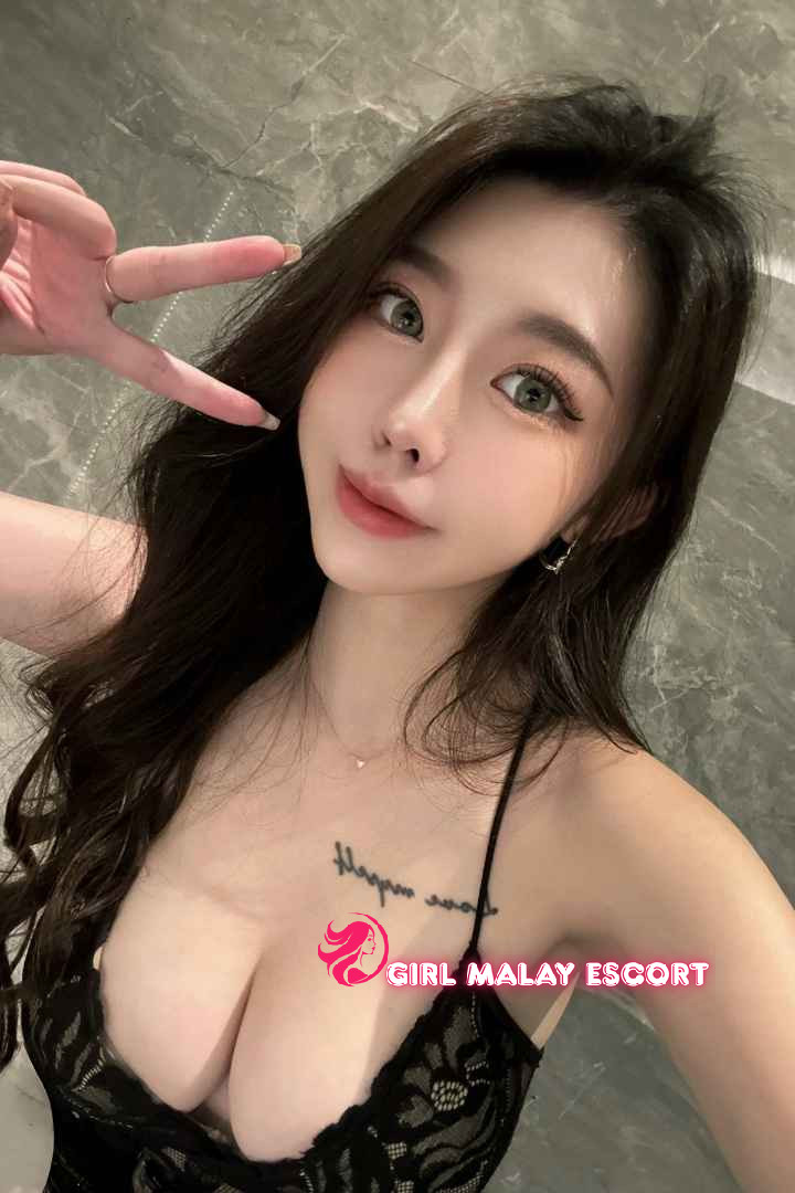 Attractive Malay woman in black lace top. Girl Malay Escort.