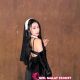 Attractive Malaysian female escort in black dress.