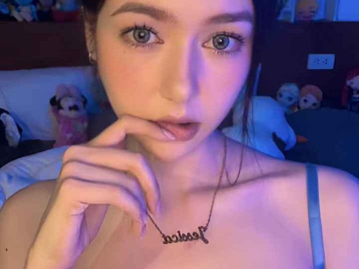 Attractive Malay woman in a bra, wearing a necklace with her name. Girl Malay Escort.